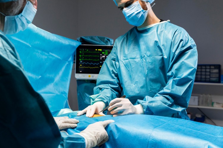 Medical team performing a surgical procedure in an operating room